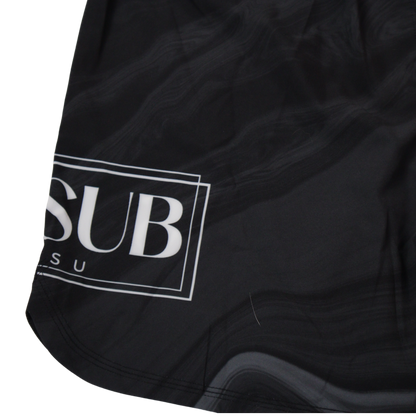 close up of marble black no gi shorts displaying company logo