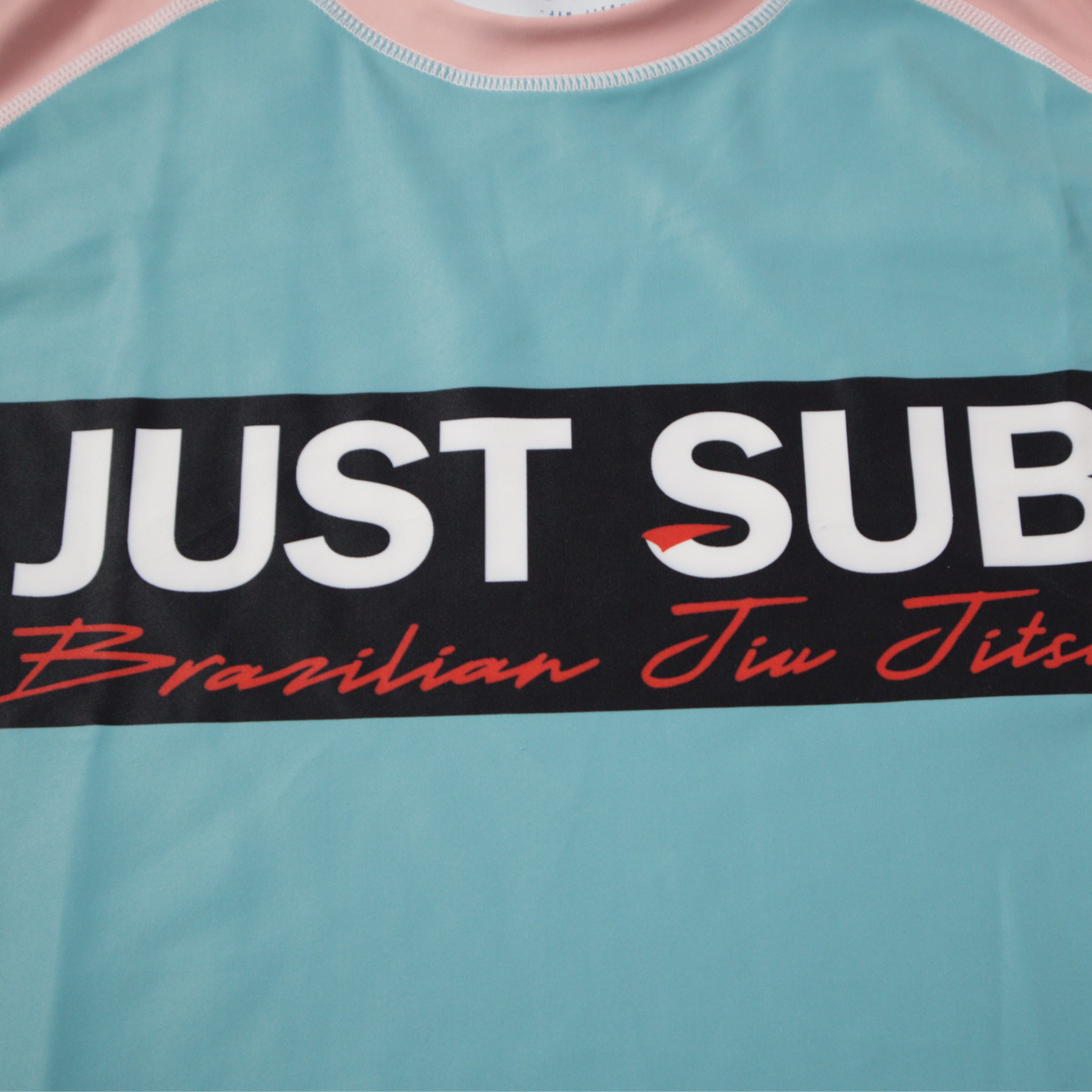 nogi bjj real teal rashguard close up logo